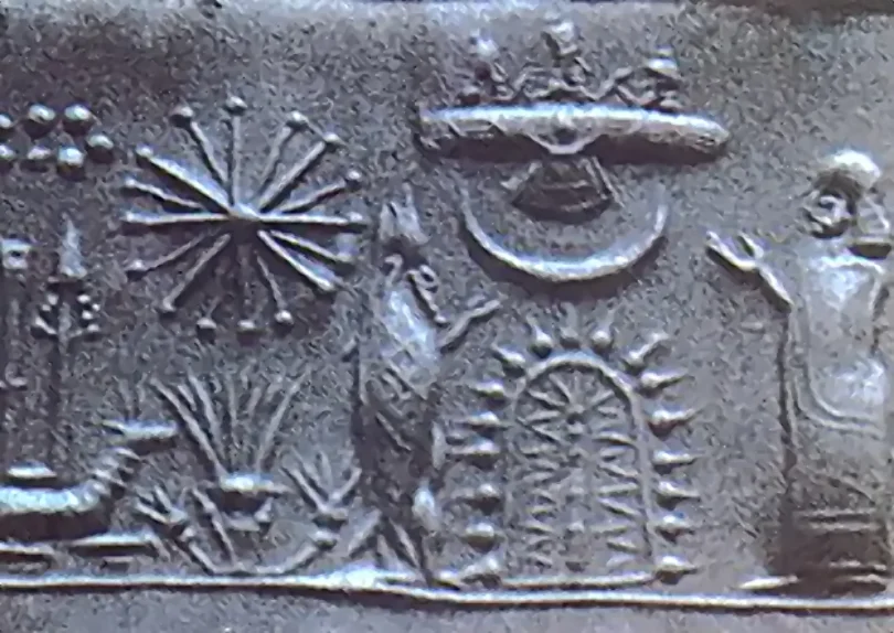 Impression of a Mesopotamian cylinder seal rolled into clay, showing a procession of figures carved in miniature